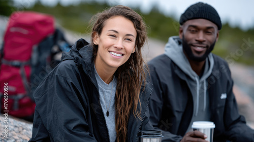 A smiling woman and man share a joyful moment in an outdoor setting, showcasing happiness, connection, and relaxation amid nature's beauty.