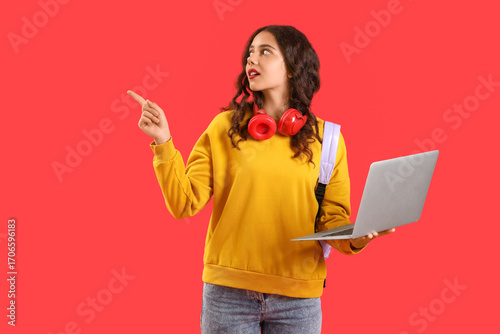 Female student with laptop ...