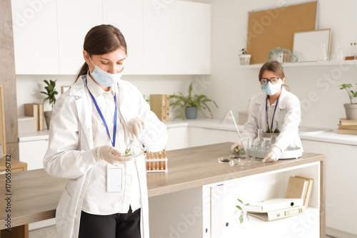 Female scientist working with Petri dish in laboratory