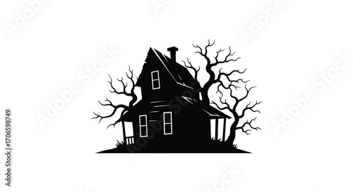 haunted house surrounded by eerie bare trees at night
