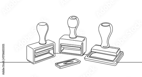Outline of rubber stamps and a paper cutter on white background  