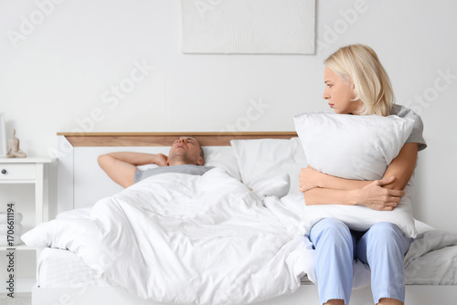 Irritated mature woman with...