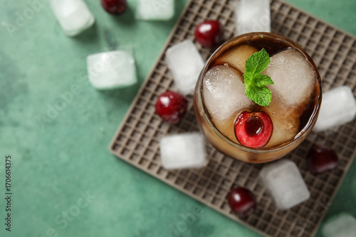 Glass of drink with cherry,...