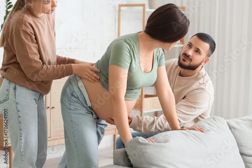 Young pregnant woman breath...