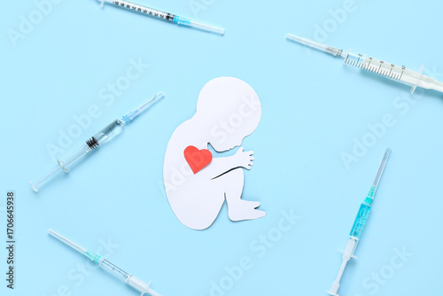 Paper baby figure with hear...