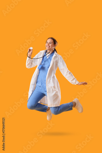 Young happy female doctor w...