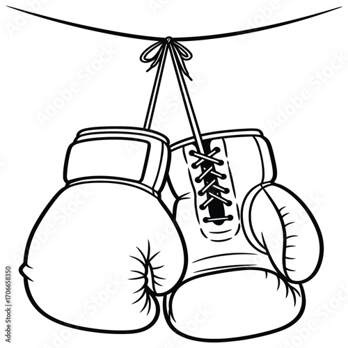 Classic boxing gloves hanging on a string ready for a championship match.