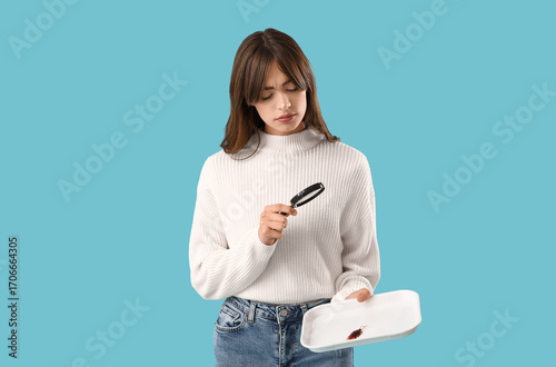 Young woman with cockroach ...