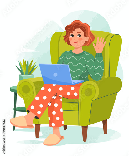 A woman waves cheerfully while sitting in a comfortable green chair with her laptop, showcasing a relaxed atmosphere and the joy of digital connection in modern home life.