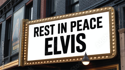 A solemn tribute on a brightly lit theater marquee, displaying a Rest in Peace message to honor the memory of a beloved musical icon