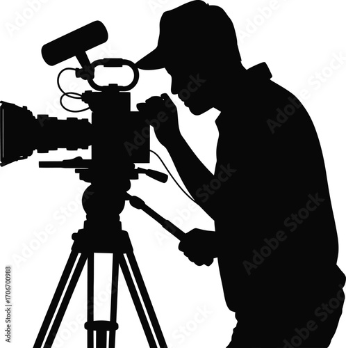 Cameraman filming a video with a professional camera silhouette