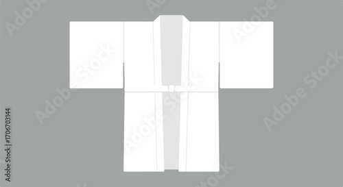 Minimalist presentation of a pristine white kimono garment on neutral backdrop creating a feeling of pureness and cultural awareness