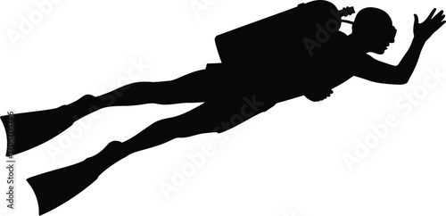 Silhouette of a scuba diver swimming gracefully underwater