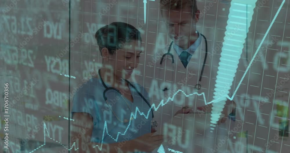 Nurse scrolling metrics on screen and initiating medical overlay while ...