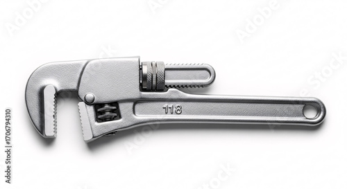 Professional metal pipe wrench tool gleaming under studio light for construction and repair projects