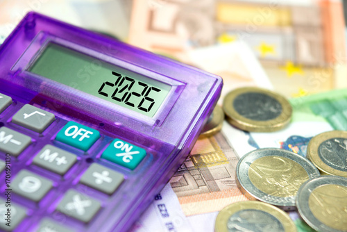 Euro banknotes, calculator and the year 2026