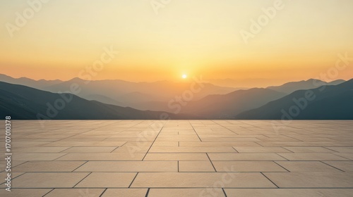Empty plaza at sunset over mountain range