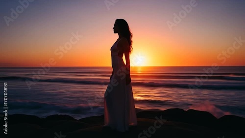 Silhouette of Woman in White Dress at Sunset by Ocean - Serene Beauty