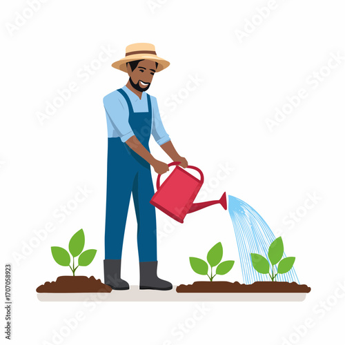Cheerful African American farmer in a straw hat and overalls watering young green plant sprouts in a garden