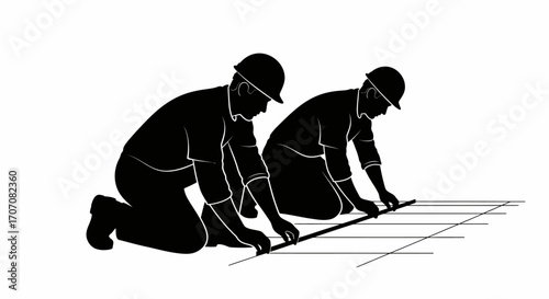 Two construction workers in silhouette, measuring and laying a floor.