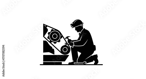 Silhouette of a worker repairing a lawnmower.