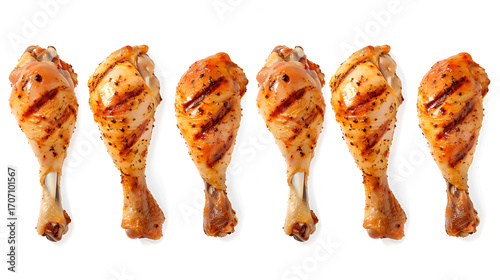 Delicious grilled chicken legs seasoned perfectly isolated on a white background