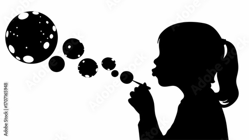 Silhouette of a girl with ponytail blowing bubbles with a wand creating floating spheres in black and white