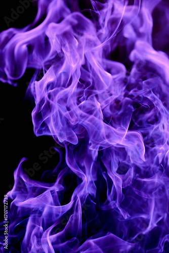 Purple flames on black background with purple fire, smoke, burning light, glowing abstract energy and fantasy dark color scheme.
