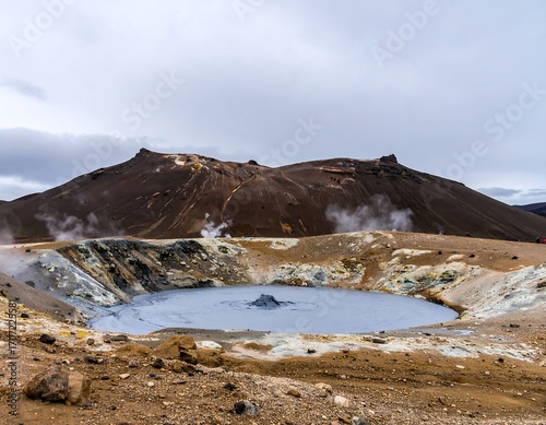 Volcanic crater with mud pool and steam