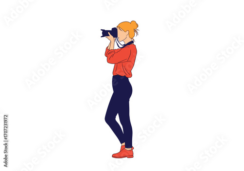 A professional photographer capturing a moment with a digital camera.