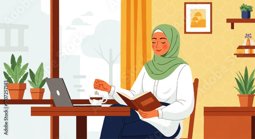Woman in hijab reading a book at a table with a laptop and coffee.