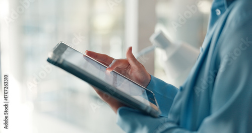 Photos Hands, tablet and scroll with business woman in office for planning, magazine editor and research