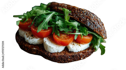 Fresh, whole-grain sandwich with mozzarella, cherry tomatoes, and arugula
