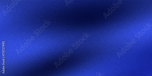 Abstract blue background with noise texture and soft gradient. The lighting variations in the image create a 3D effect.