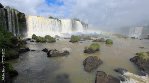Iguazu Falls, waterfalls of Iguazu River on border of Argentine and Brazilian state of Parana. Panoramic view of magnificent natural wonder of the world. Brazil side. Brazilian wilderness landscape.