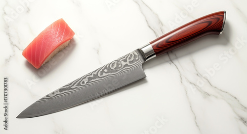 Elegant sushi knife with damascus pattern on marble surface for culinary excellence