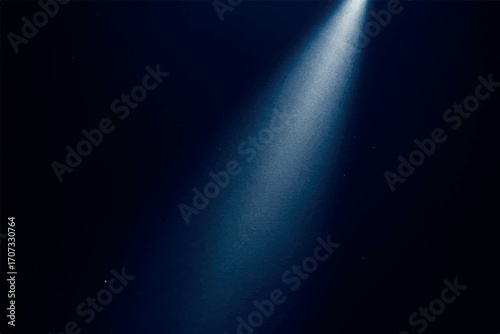 Spotlight beam illuminating a dark background, showcasing a concentrated light source.