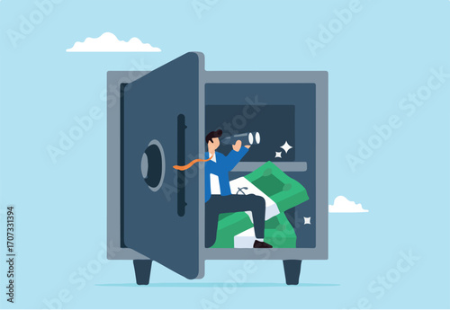 Businessman using binoculars at secured open safe