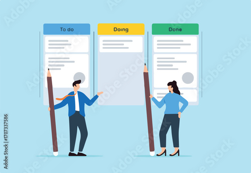Business people review project progress on kanban board