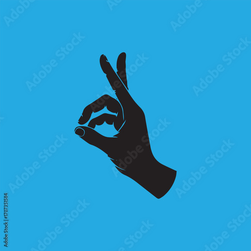 Silhouette of a hand forming the "OK" gesture against a vibrant blue background.