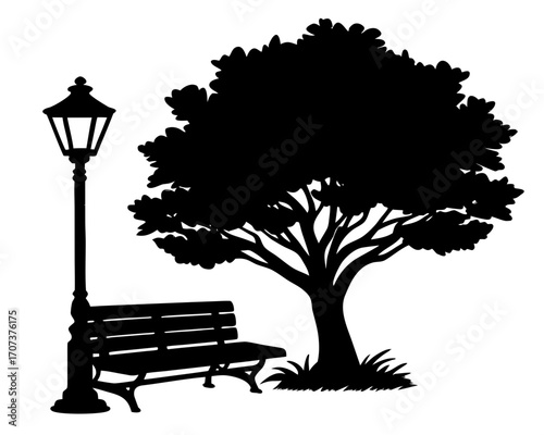 Silhouette of a park bench, lamppost, and tree
