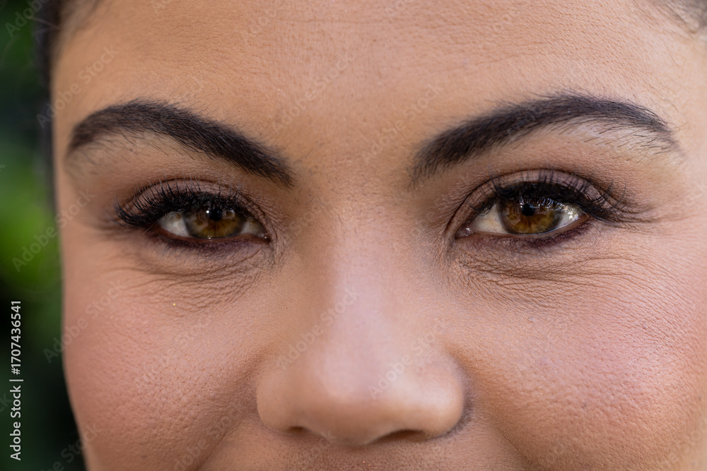 Fototapeta premium Close-up of woman's eyes with natural makeup, showcasing beauty and elegance