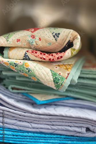 Vertical stack of folded quilts