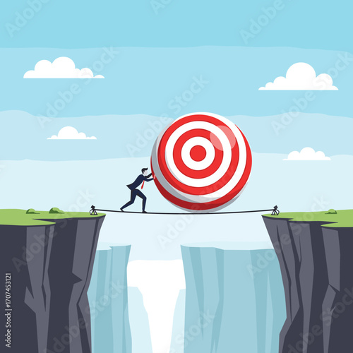 Businessman carefully pushing large target ball across a narrow rope bridge over a deep chasm representing challenges and risks on the path to achieving goals