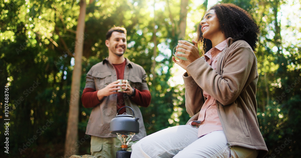 Fototapeta premium Happy couple, hiking or relax in forest for coffee break, camping adventure or holiday in nature. Weekend travel, morning chat or people in woods for romantic getaway, bonding or breakfast together
