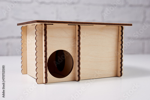 with wooden house on background brick