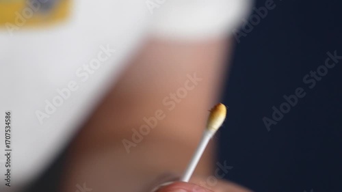 A dirty cotton swab after ear cleaning.
Ear wax on a cotton swab for ear cleaning (macro video).
Brown dirt on an ear swab after ear hygiene.
Cotton swab, cleaning, ears, dirty