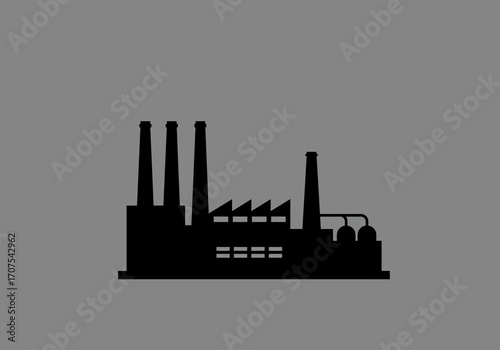 A black silhouette of a factory is shown against a grey background The factory has chimneys pipes and storage tanks