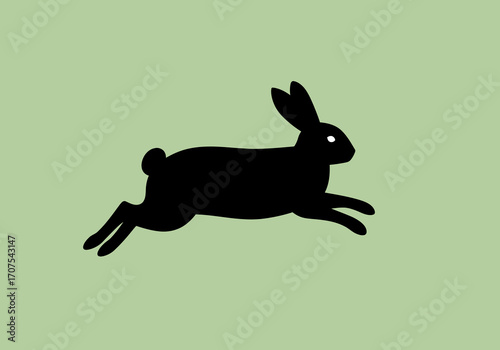 A black silhouette of a rabbit leaping across a light green background