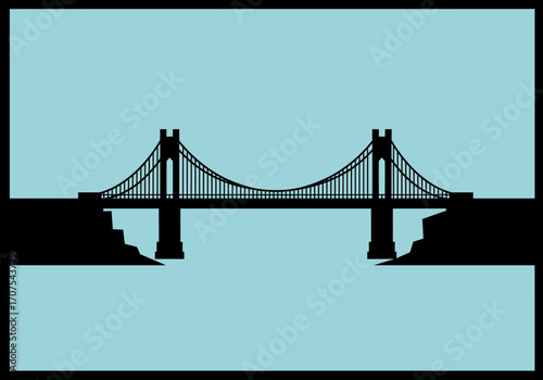 A silhouetted suspension bridge spans a gap connecting cliffs against a pale blue background